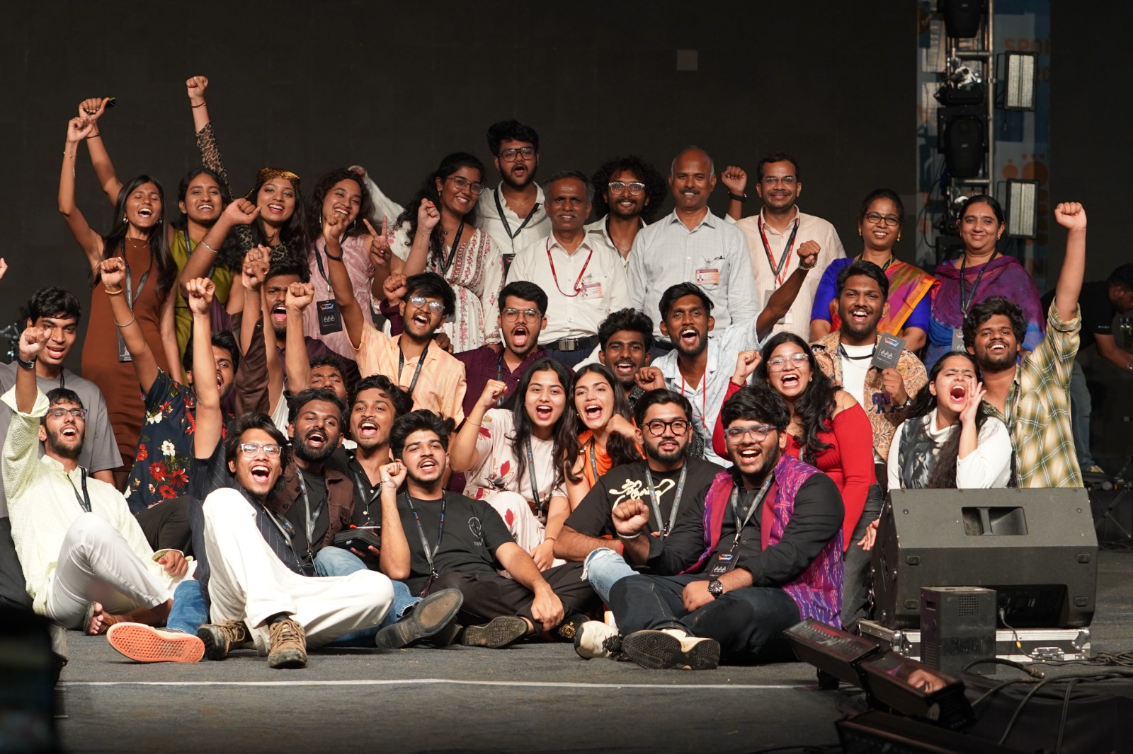 Students celebrating together on stage.
